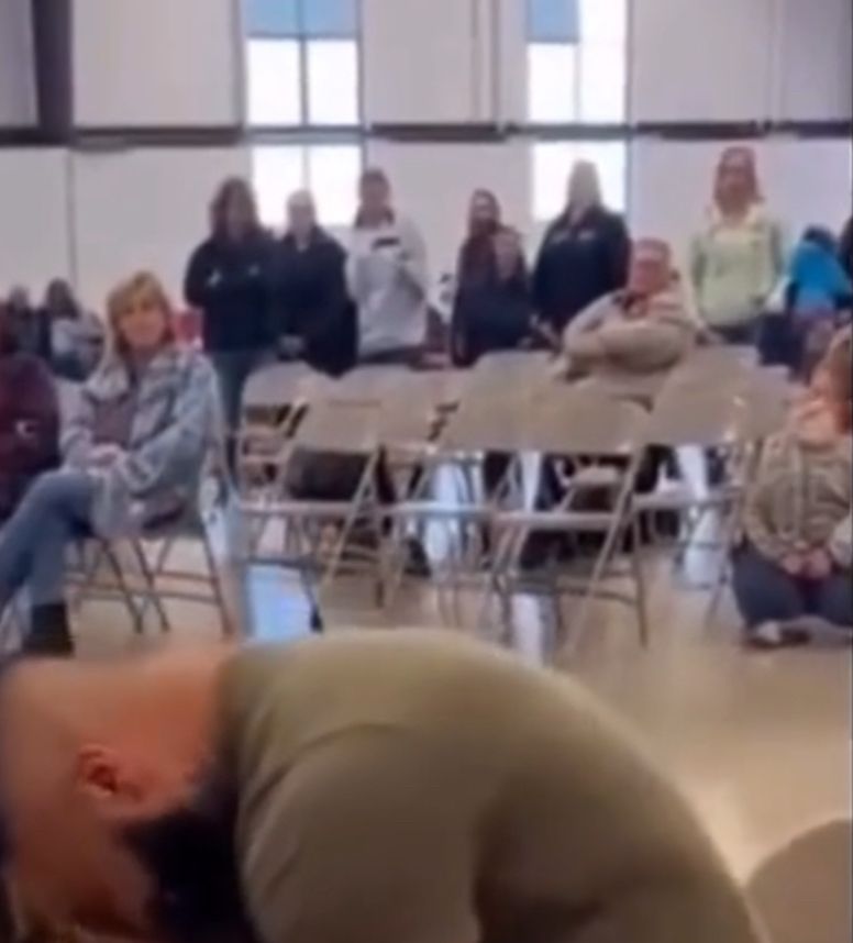 Frame from a fake AI generated video.

In the foreground, and earhole melts into a neck shape. In the background, a tribe of faceless figures gaze at nothing, without any emotion. A headless blob sits on the floor.