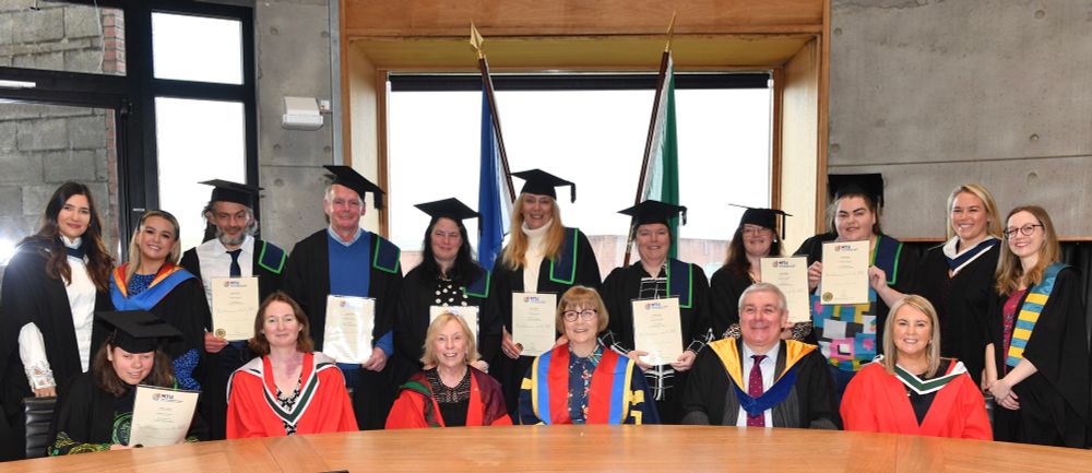 MTU’s most recent graduates pictured at their conferring ceremony, with MTU President and staff and post-graduate student partners