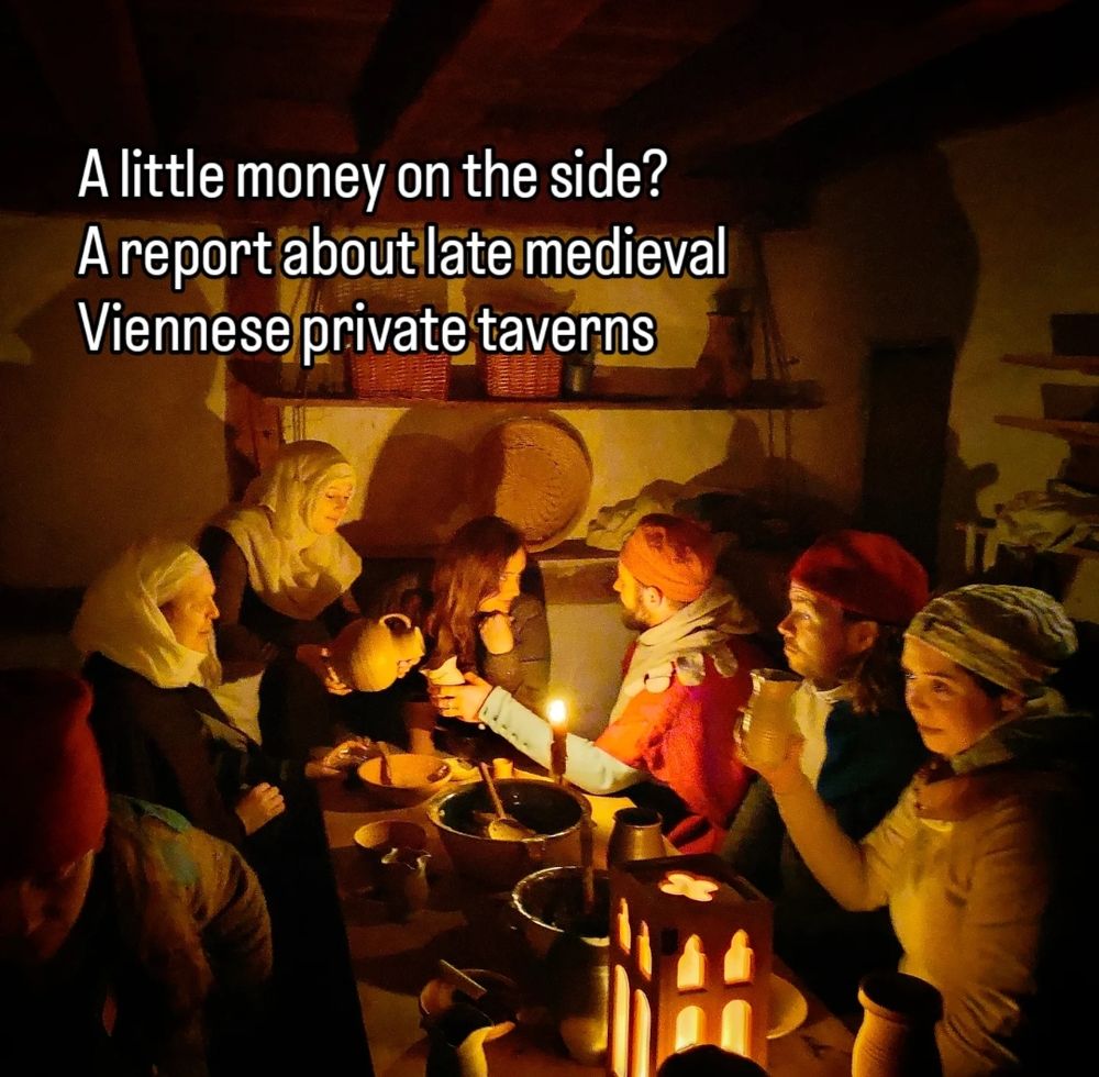 A group of people in medieval clothing sitting around a nightly table and celebrating
