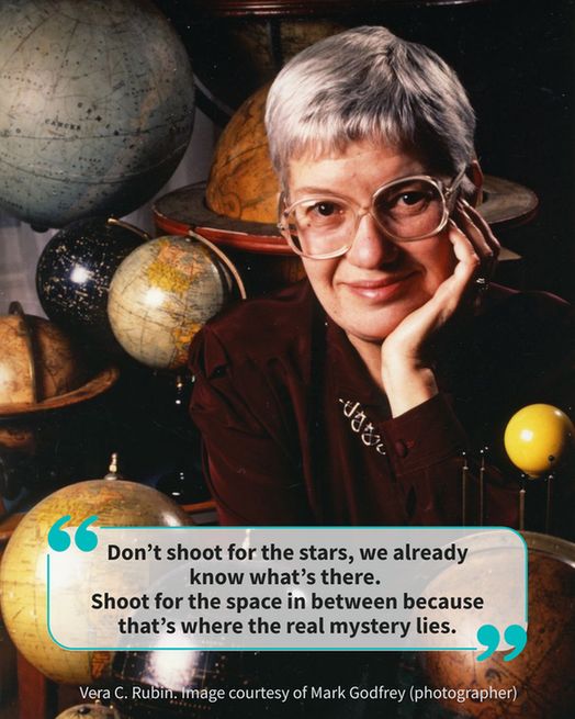 An older woman with short gray hair and glasses, surrounded by globes of various shapes and colors. A quote box in the bottom half of the screen has the text "Don’t shoot for the stars, we already know what’s there. Shoot for the space in between because that’s where the real mystery lies."