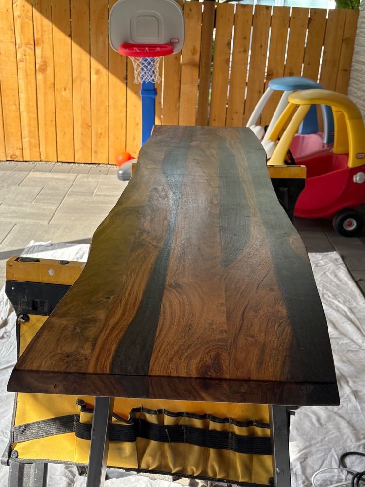 Original photo of rosewood bench. Poly finish is beat to hell, a couple gouges. Looks like shit.