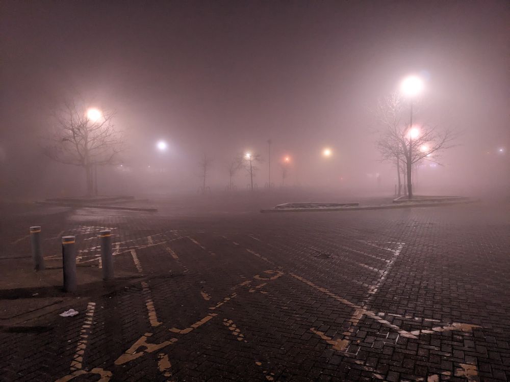 A mist shrouded car park. 