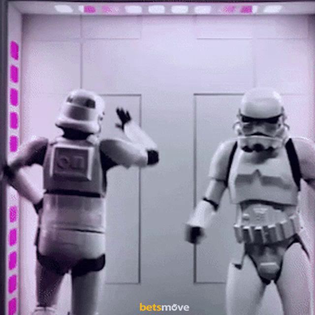 two stormtroopers are standing next to each other with the words betsmove visible in the corner