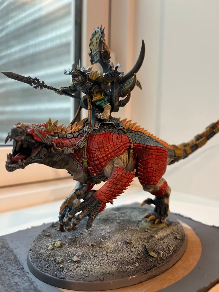 Saurus old blood on carnisaur painted orange, black and red