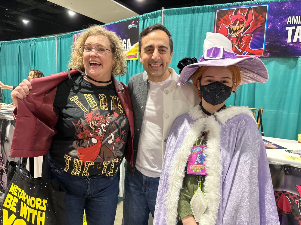 Photo of me, Amir, and my kid (in cosplay) at Galaxycon