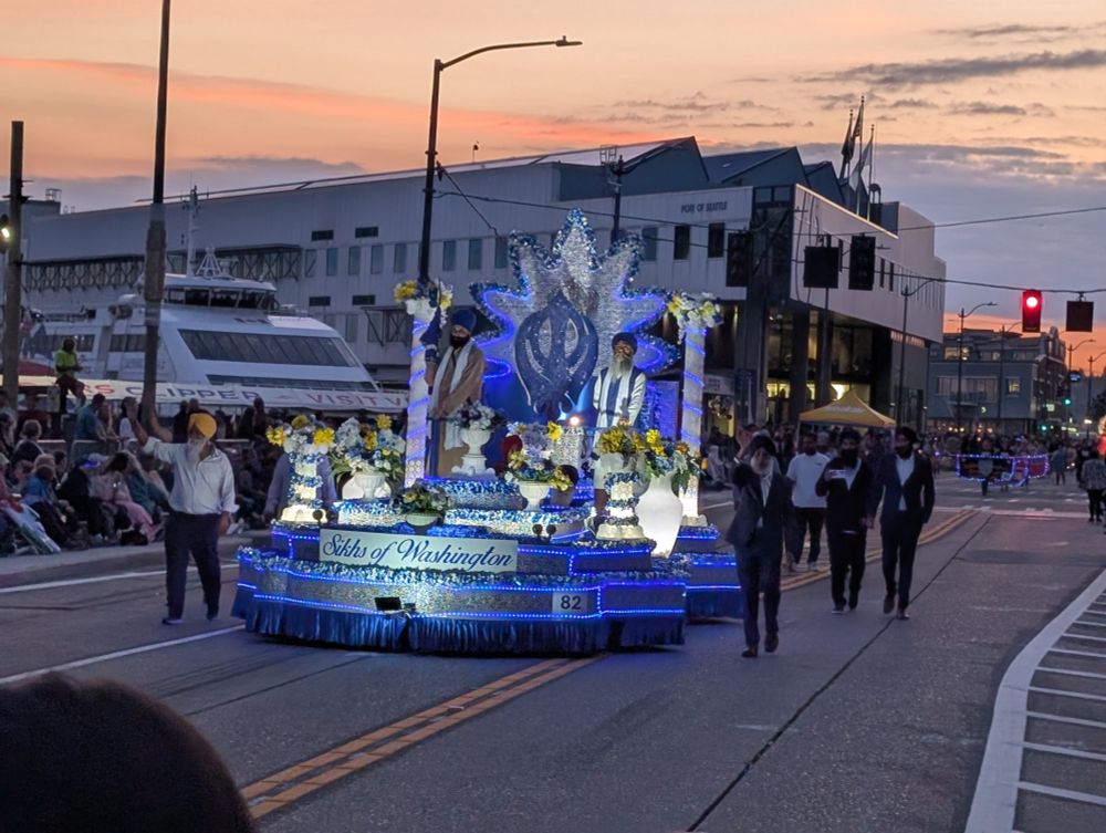 Sikhs of Washington float, a blue and silver shiny lit up parade float