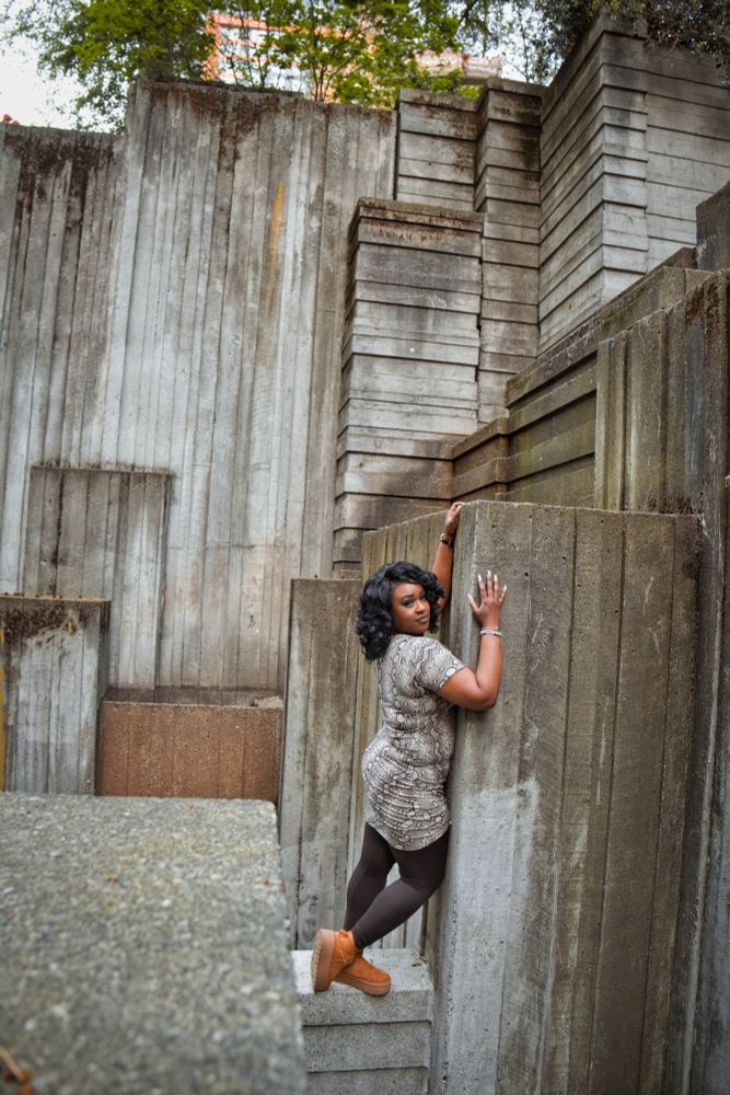 Jue Ve Jones standing in an angular concrete park in Seattle