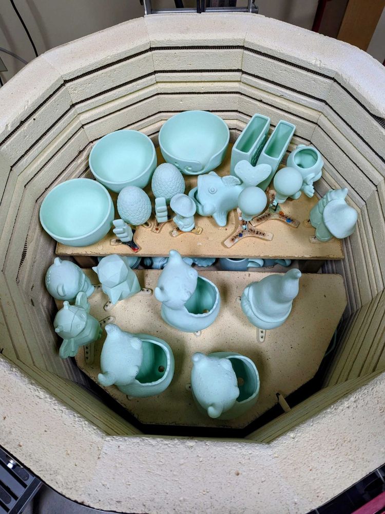 Kiln half-full of glazed ceramic pieces
