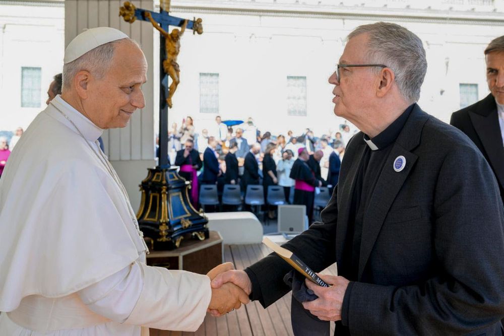 Pope Leo shaking hands with James Keenan SJ