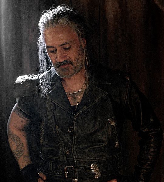 Taika Waititi as Edward Teach with his little updo looking like a snack while trying to convince Izzy to kill him.