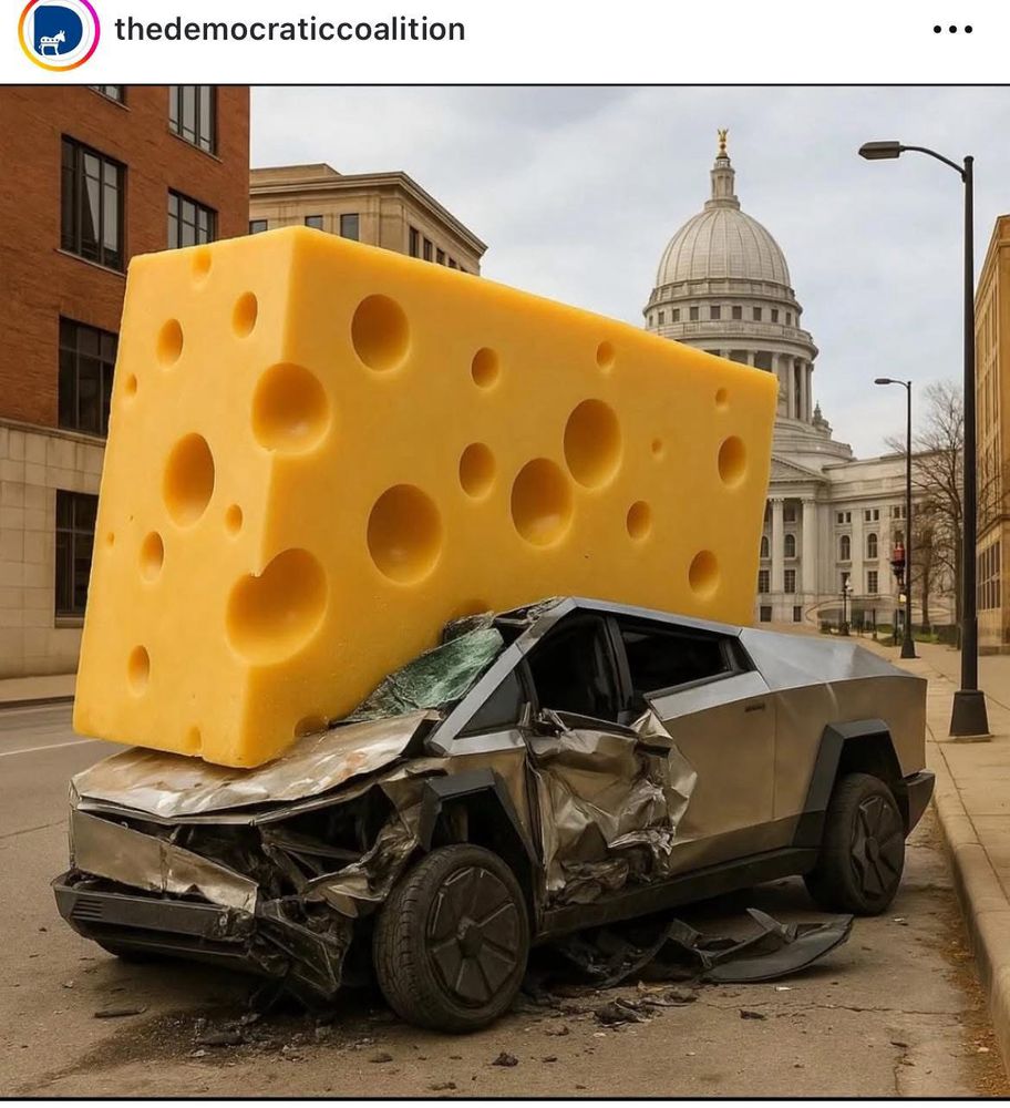 Cybertruck crushed under a wedge of Wisconsin cheese.
