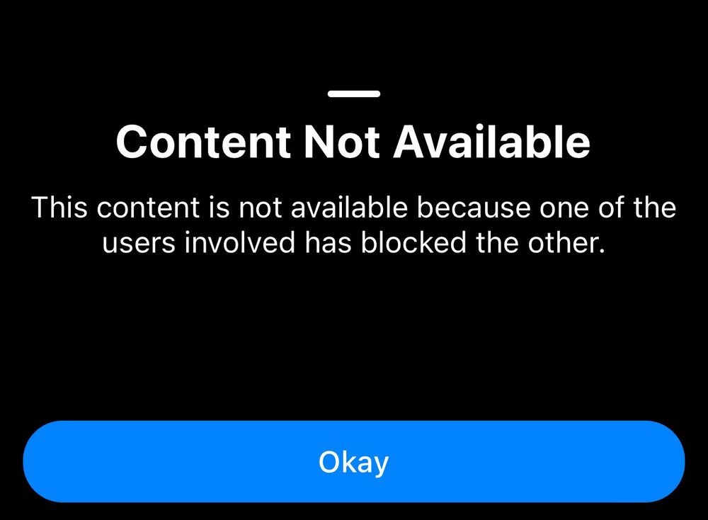Bluesky notification reading "Content not available. This content is not available because one of the users involved has blocked the other" and a button reading "Okay"