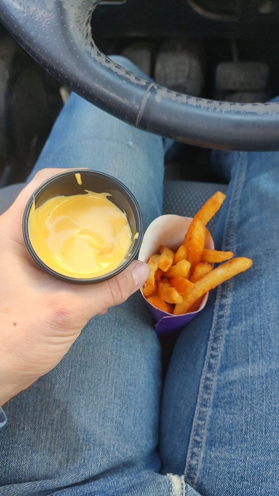 Nacho fries in my lap, I'm eating in my car between clients