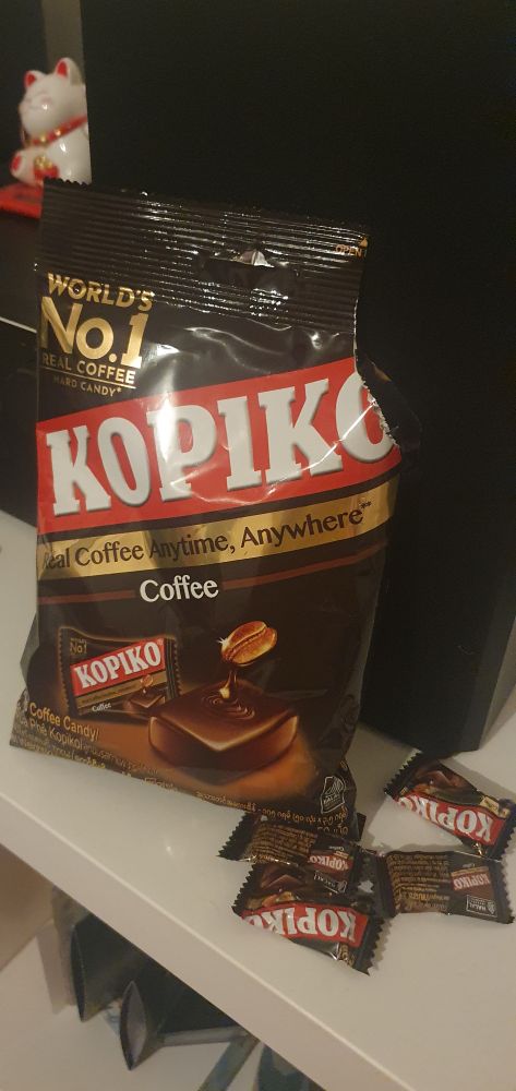 Open bag of kopikos. With several cute little kopiko the side