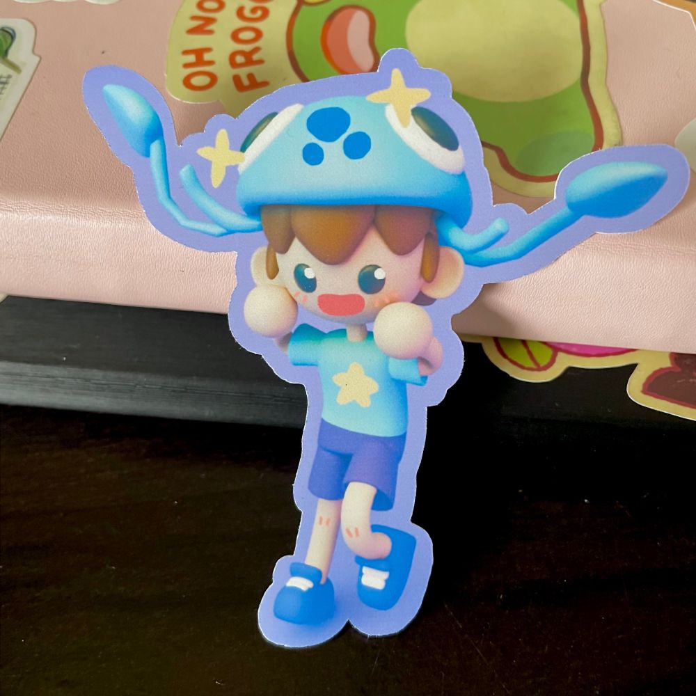 photo of sticker of a character I made in blender named jellyfish kid that's a a brown haired kid with a blue jellyfish as a hat
