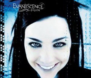 amy lee on evanescence album cover with a fake smile 