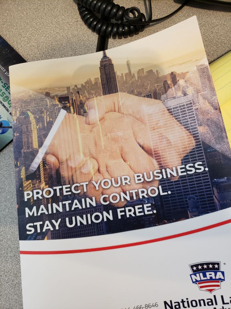 Printed pamphlet with two white men shaking hands. The text reads "protect your business. Maintain control  stay union free."