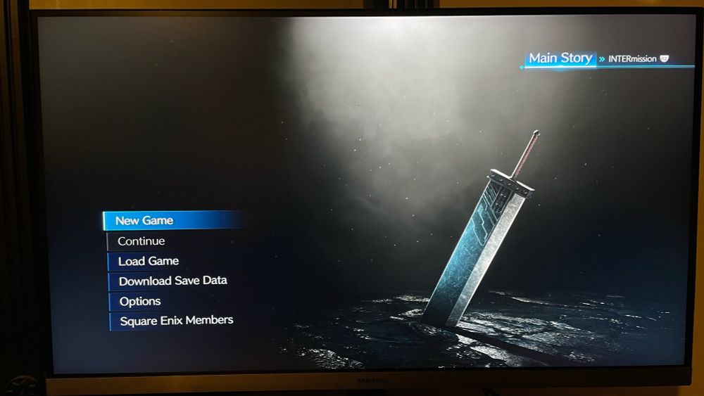 Final Fantasy 7 Remake menu screen. The Buster sword sticks out of the ground as light shines on it.