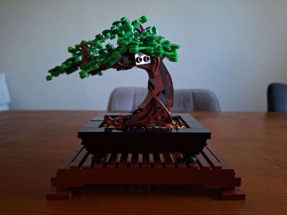 A photo of the LEGO bonsai tree set. It is in its traditional configuration with dark and bright green leaves.