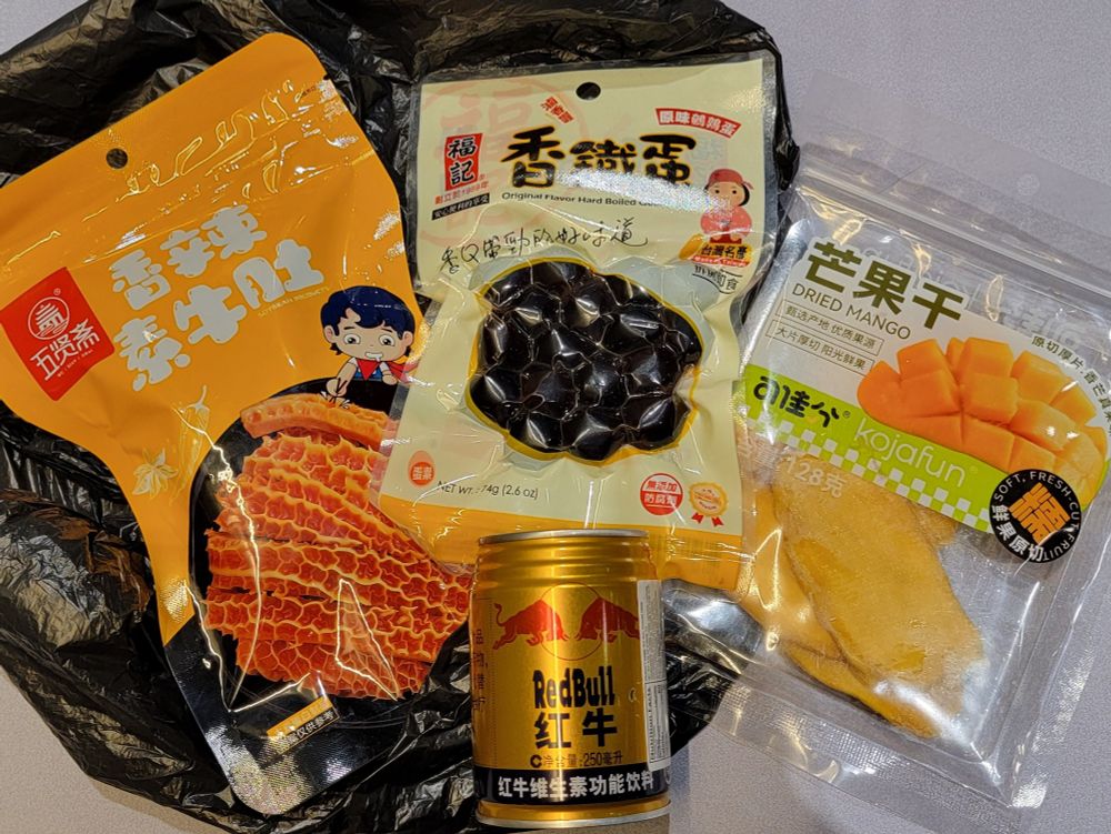 Spicy honeycomb tripe snacks, iron quail eggs, dried mango, 紅牛