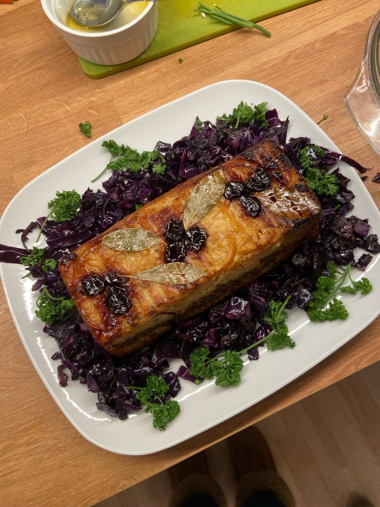 Christmas nut roast, decorated with sour cherries and bay leaves. 