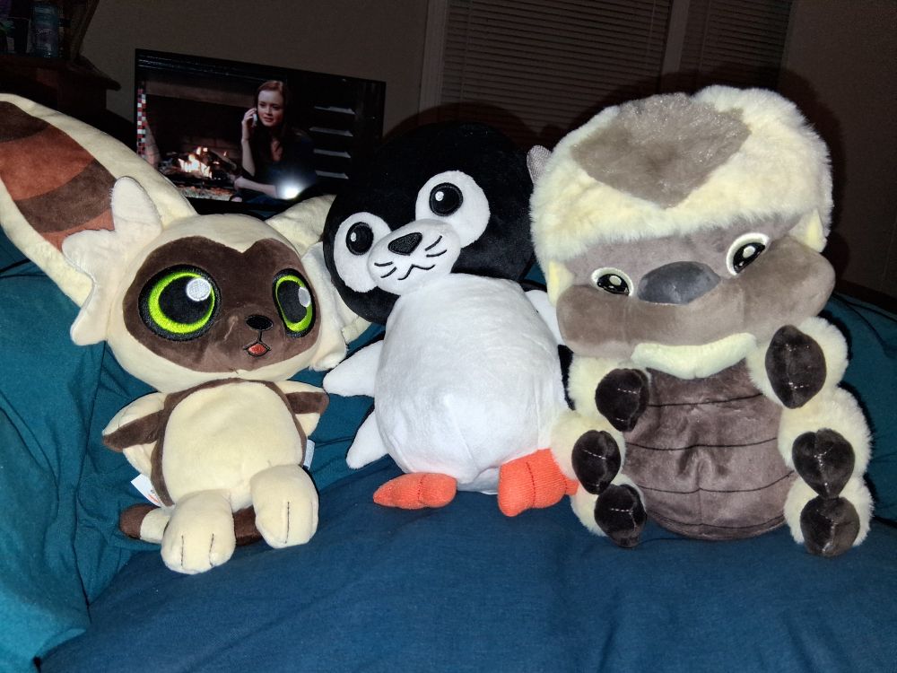 Plushies of Momo, an otter penguin and Appa from Avatar the Last Airbender