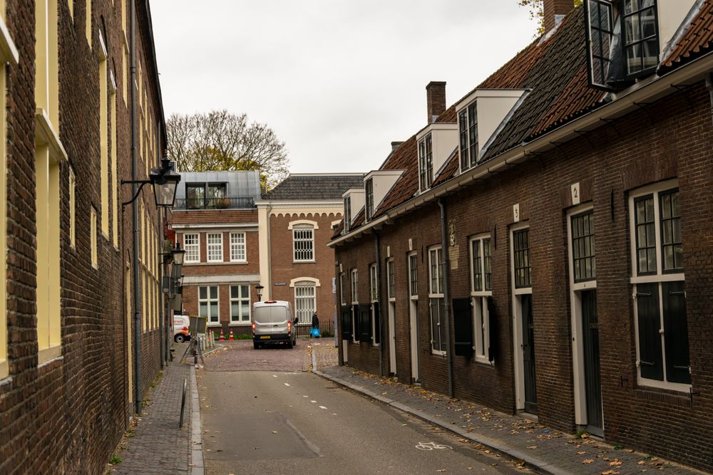 narrow residential street with a lot of brick buildings
