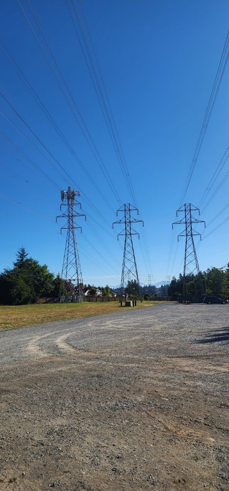 a photo of sky with electric towers