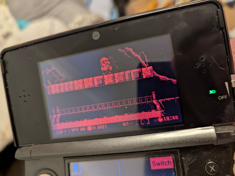 A photo of Virtual Boy Wario Land running on a 3DS, with ghosting from the display showing a 3D image.