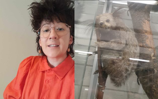Photo of a very tired Emily on the left, with a slightly pained smile/grimace, and a poor quality photo of some a poor quality taxidermy of a primate (?) on the right, also with a slightly pained smile/grimace