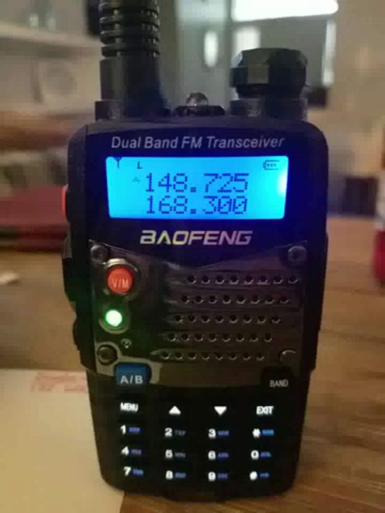 a baofeng dual band fm transceiver is on a table