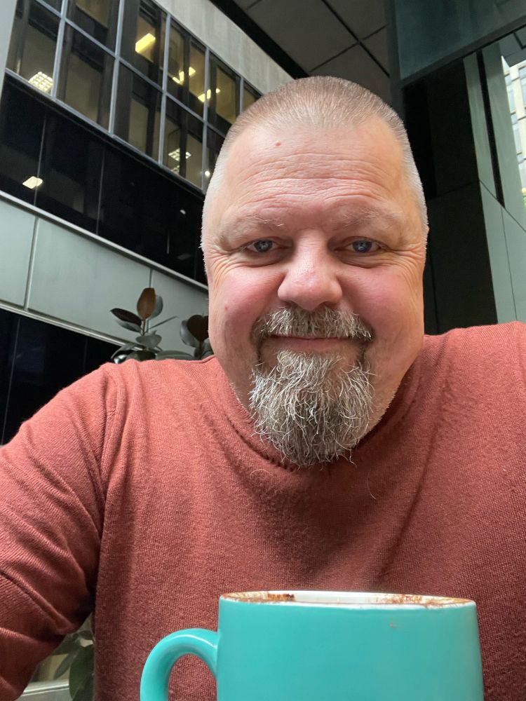 Guy having morning coffee