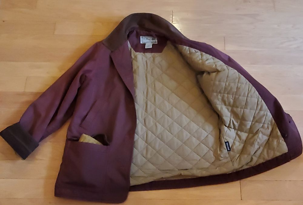 a photo of the jacket with one side flopped open to see the quilted inner lining. it's SOOOOO clean now lmfao and the polyester didn't pick up the dye at all, it looks perfect