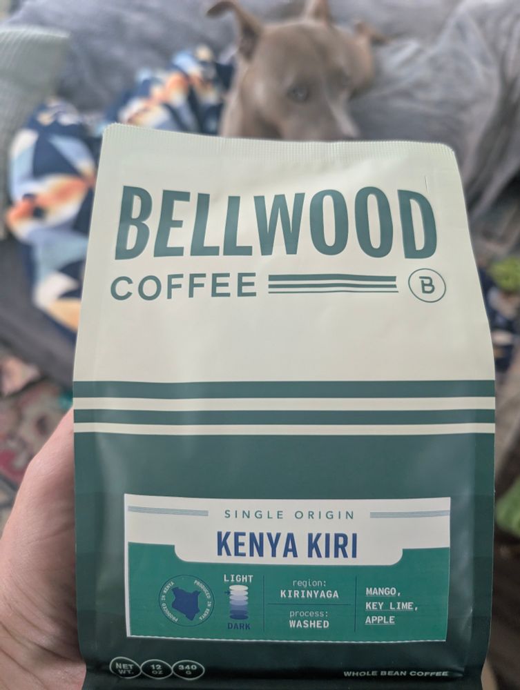a bag of off-white and forest green coffee labeled:
BELLWOOD
COFFEE

SINGLE ORIGIN
KENYA KIRI

region: KIRINYAGA
process: WASHED

MANGO,
KEY LIME,
APPLE

WHOLE BEAN COFFEE