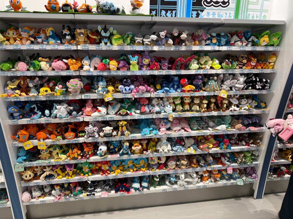 A wall of Pokémon plushies