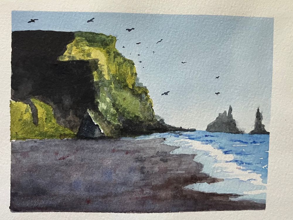 A watercolor painting of the black sand beach in Iceland. A cliff with bright green sections and very dark shadows stands above the beach, with many distant birds flying around it.