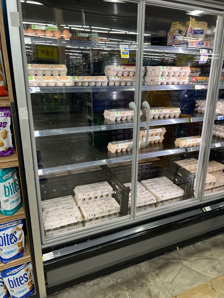 A refrigerated case at a King Soopers in Colorado is very low on eggs. 