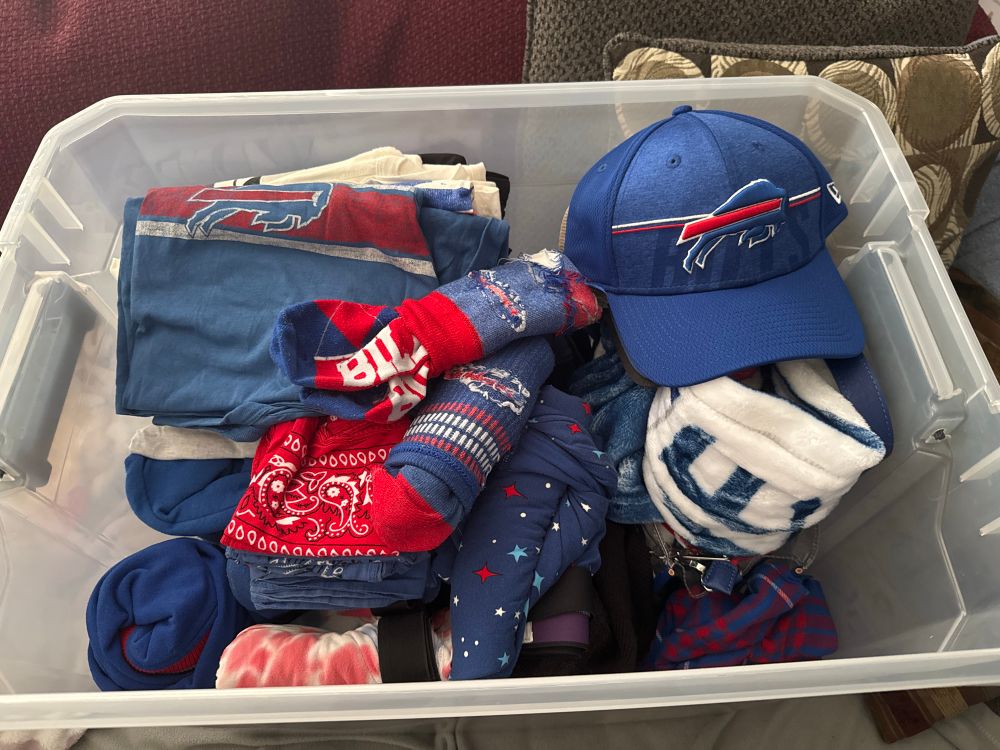 A tote filled with Buffalo Bills apparel 