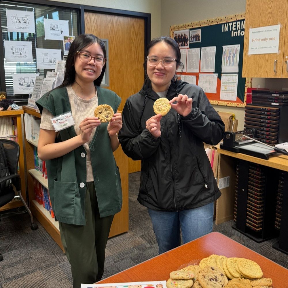 Student employees eating cookies 