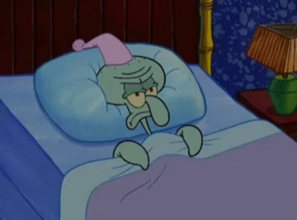 squidward from spongebob is laying in bed wearing a pink nightcap