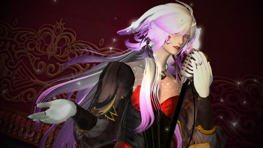 Lillium, with his hair down and white, holding a microphone in one hand and gesturing with the other. His mouth is slightly parted as if he is singing softly. He is wearing a tight red dress with sheer sleeves and a corset.