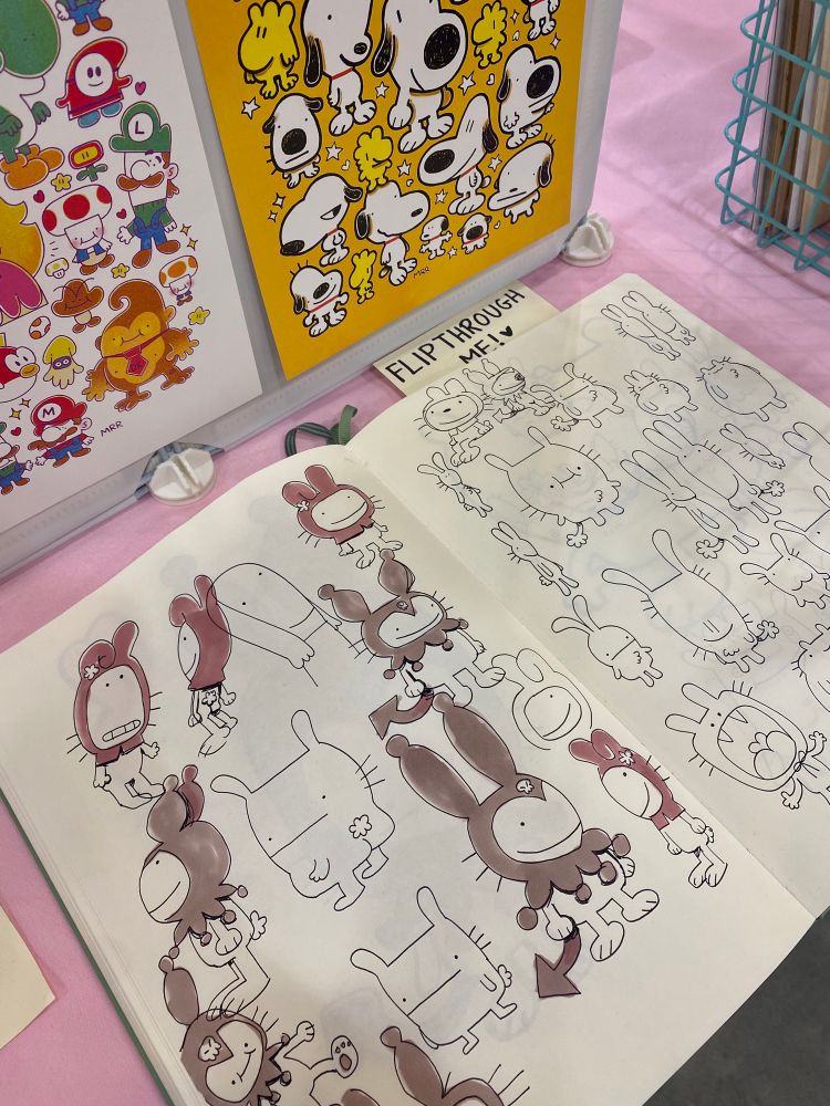 A photo of my sketchbook on my table at Lightbox Expo