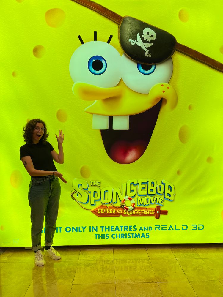 A photo of me standing in front of a SpongeBob 4 movie poster!