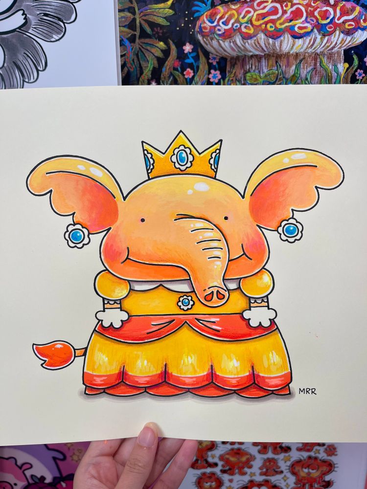 A hand holding up a traditional illustration of Princess Daisy as an orange elephant!