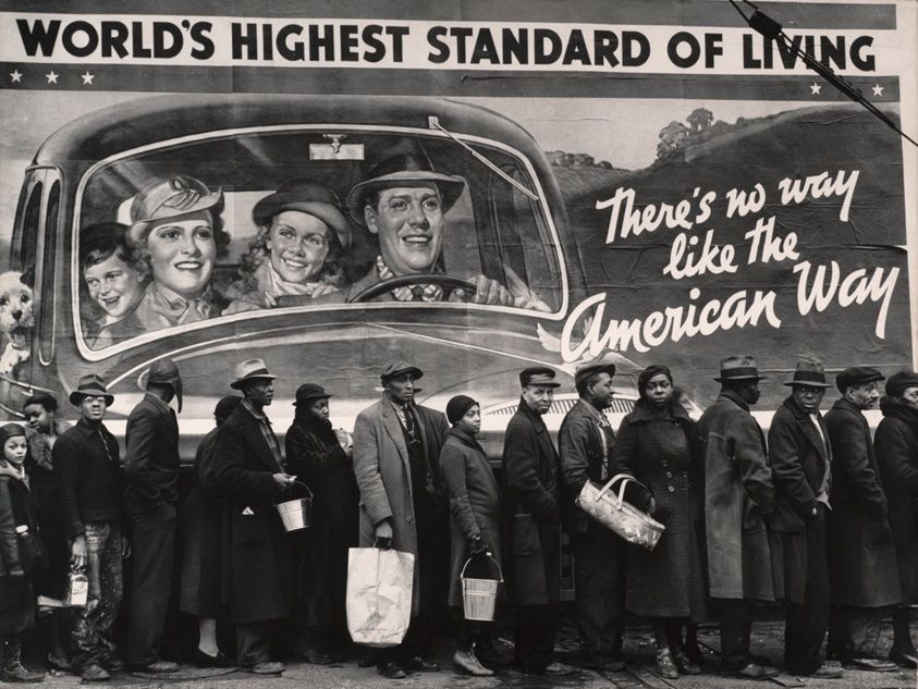 Margaret Bourke-White's famous Depression-era photo of a line of Black flood refugees in front of a billboard featuring a smiling white family in a car and reading WORLD'S HIGHEST STANDARD OF LIVING: There's no way like the American Way