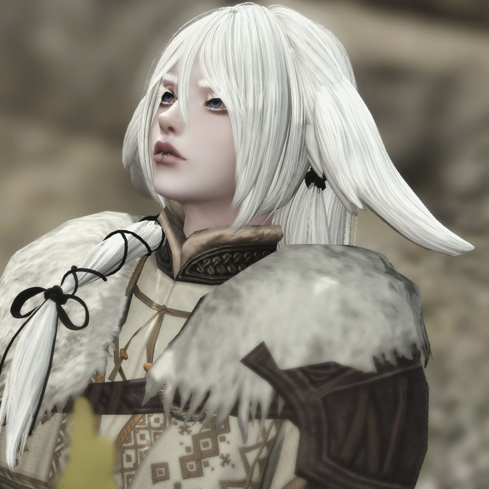 a veena viera with snow white hair and lavender eyes, yael rui, sits in front of a stone wall. they look up and to the side, off to the distance. there are cream furs on their shoulders, with a leather pauldron underneath one side. yael's ears are drooping and low on each side of their head, and a thick strand of their hair is tied with black thread, resting upon the shoulder opposite the pauldron.