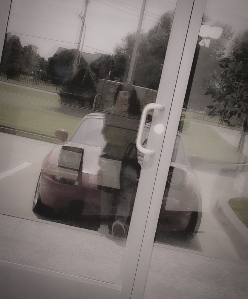 picture of me & my car in a glass reflection