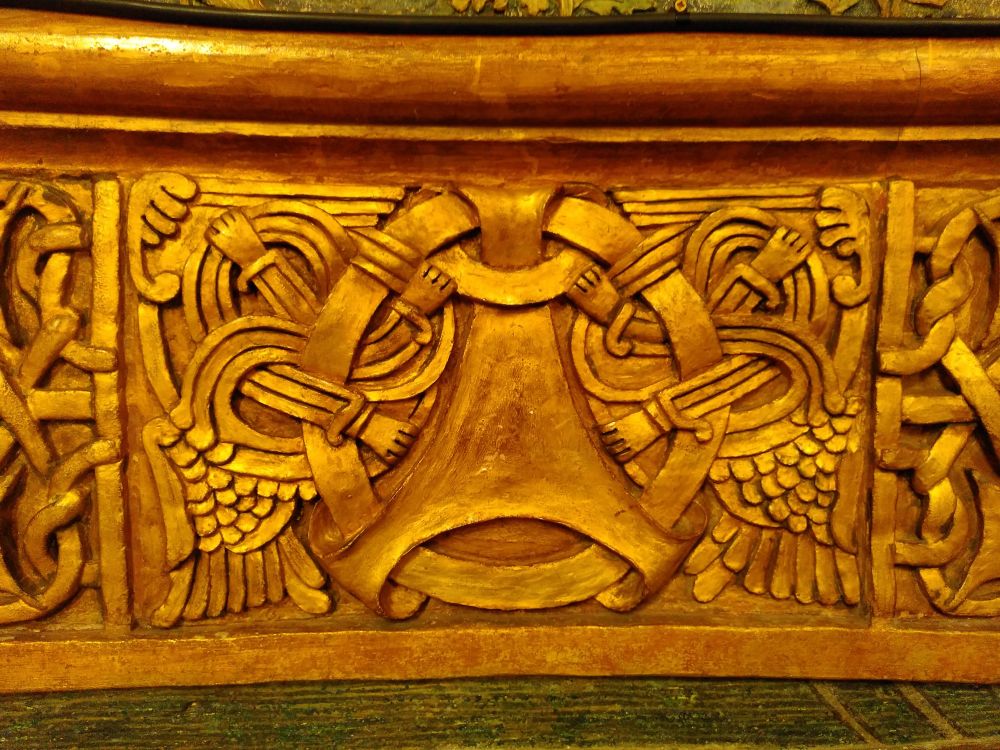 Nordic style terracotta panel with arms and hands intertwined with a circle