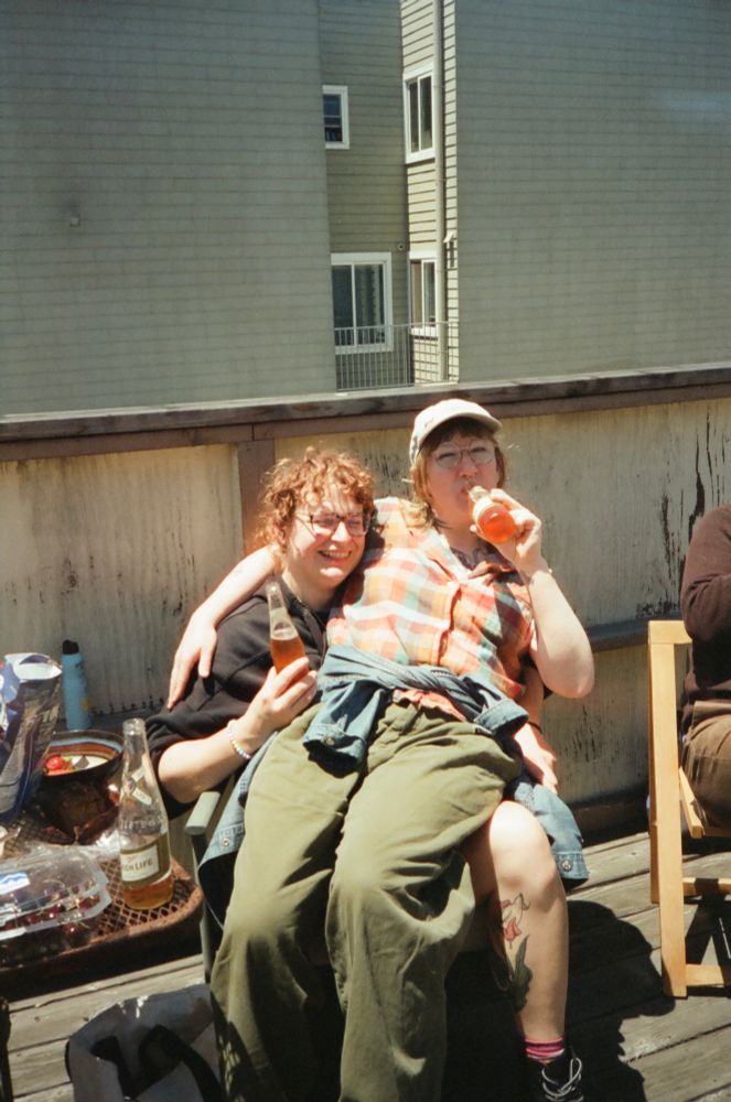 eevee with rosemary on her lap, both enjoying a spaghet