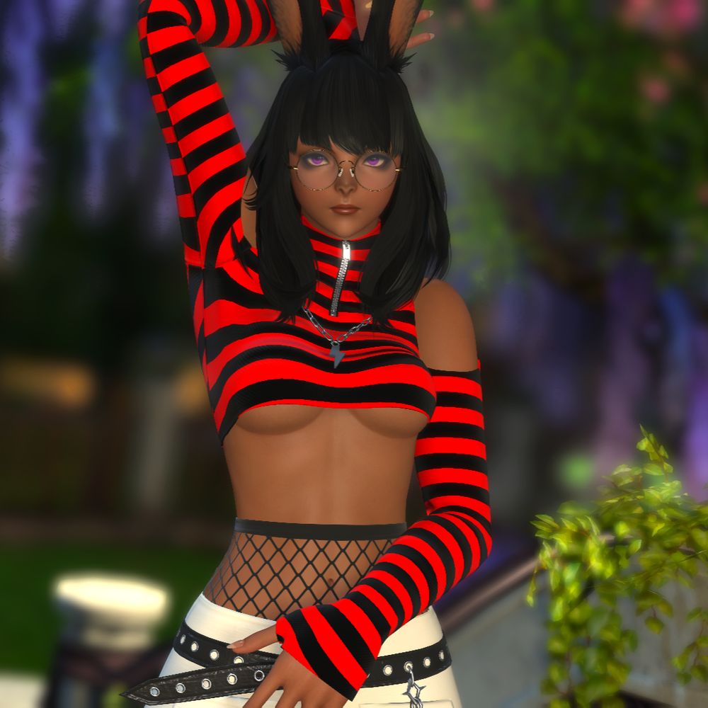 dark skinned woman staring at screen with her arms over her head